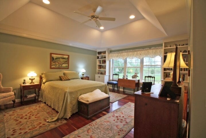 a beautiful interior painting job. Green walls in a classy bedroom